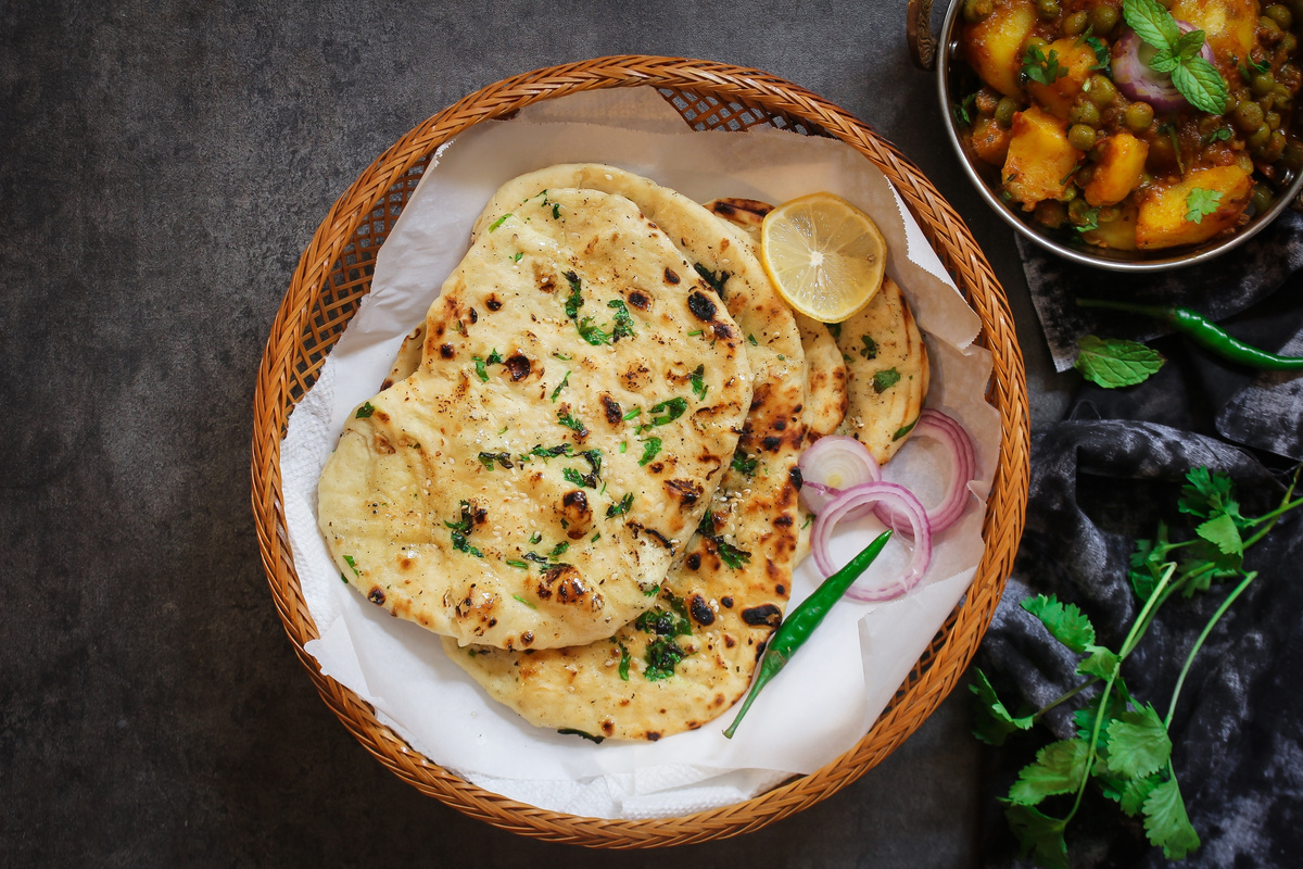 Homemade Kulcha / Indian Flat Bread Butter Naan Served with Alu Matar